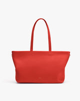 Tote bag with long handles on white background.