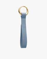 Keychain with loop strap and metal ring.