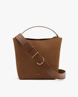 Tote bag with a wide strap draped over the front.