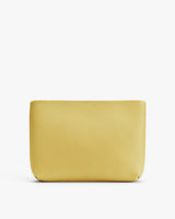 Minimalist pouch with textured surface against a plain background.