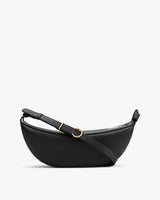 Half-moon shaped leather belt bag with adjustable strap and gold buckle.