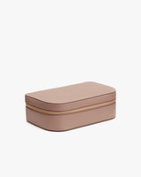 Rectangular cosmetic bag with a zipper closure on a plain background.