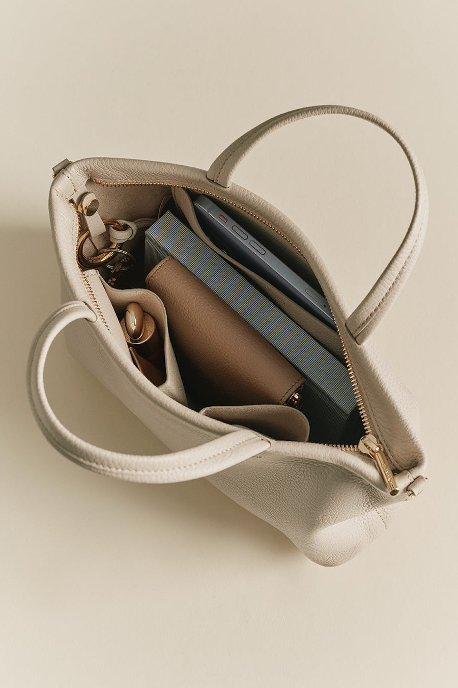 Mini Easy Zipper Tote Open handbag with visible contents including a wallet and keys.