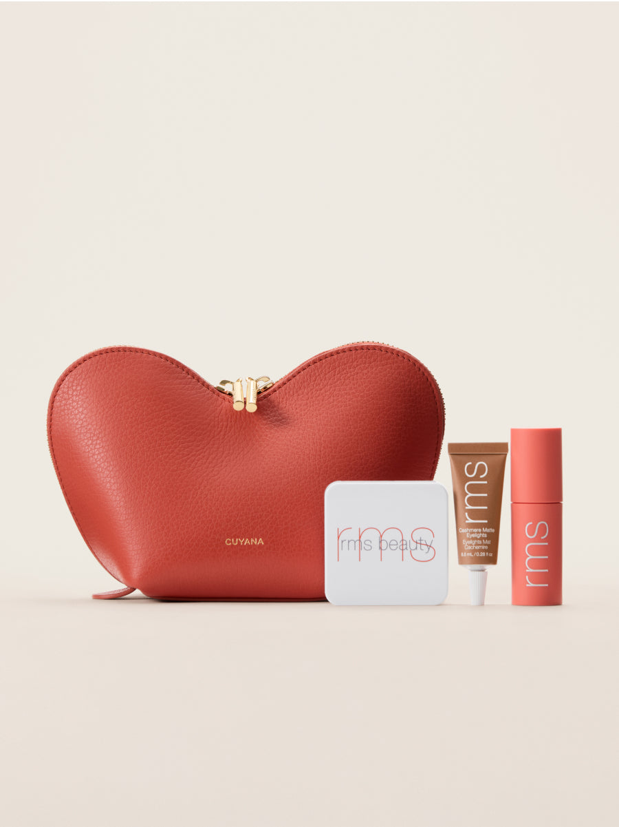 Heart-shaped pouch with three assorted cosmetics products.