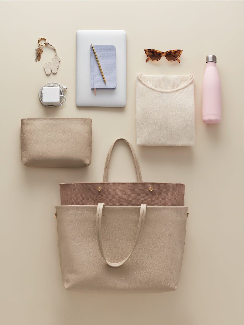 Top view of various personal items and accessories arranged neatly.