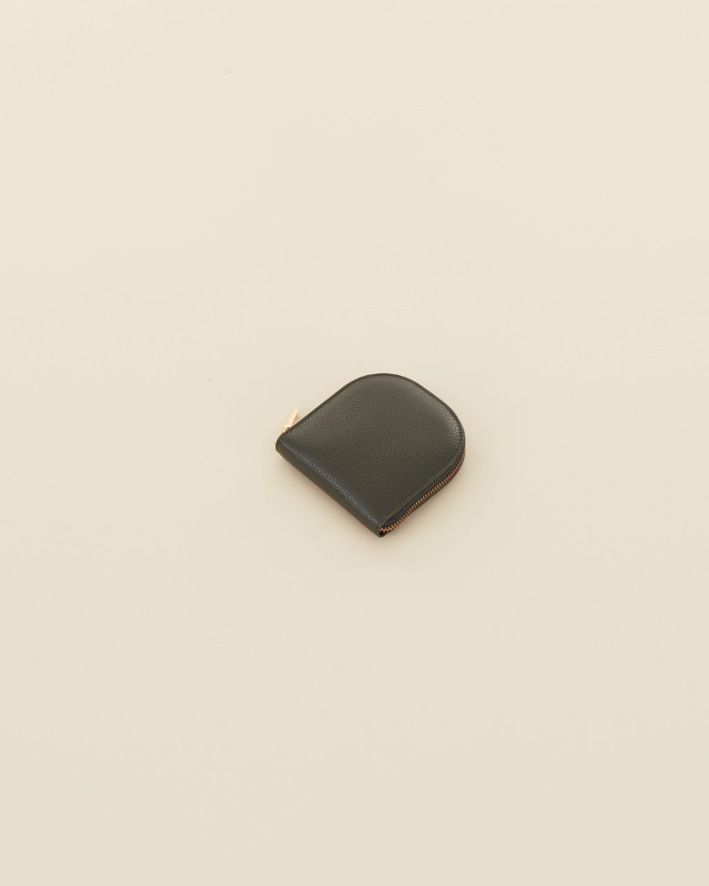 Wallet placed on a plain surface.