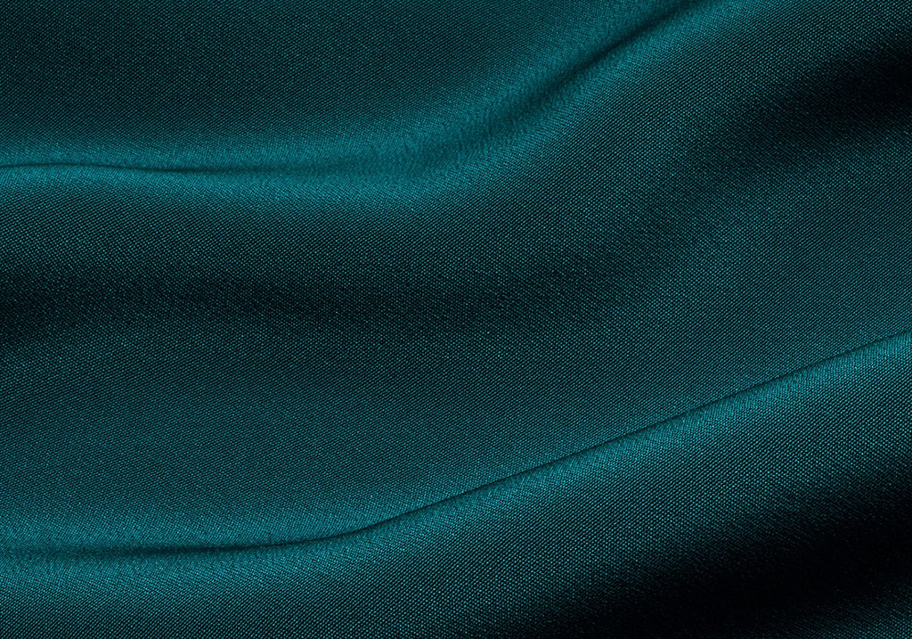 Close-up of a textured fabric with soft folds.