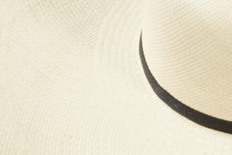 Close-up of a curved line on a textured surface.