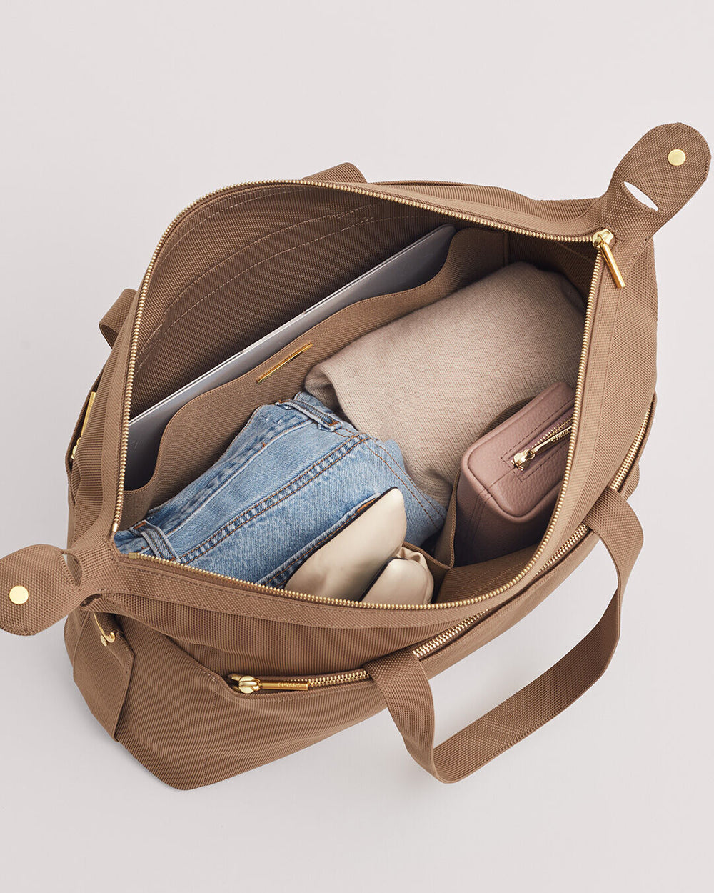 Open bag containing various items including clothing and a small pouch.