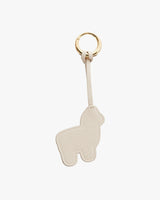 Keychain with a ring and an alpaca-shaped charm attached by a strap.