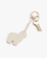 Keychain in the shape of an alpaca with keys attached.