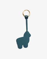 Keychain in the shape of an animal with a metal ring.