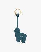 Keychain shaped like a small animal with a brand name embossed.
