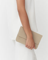 Person holding a clutch bag