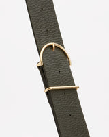 Belt with a buckle on a plain background