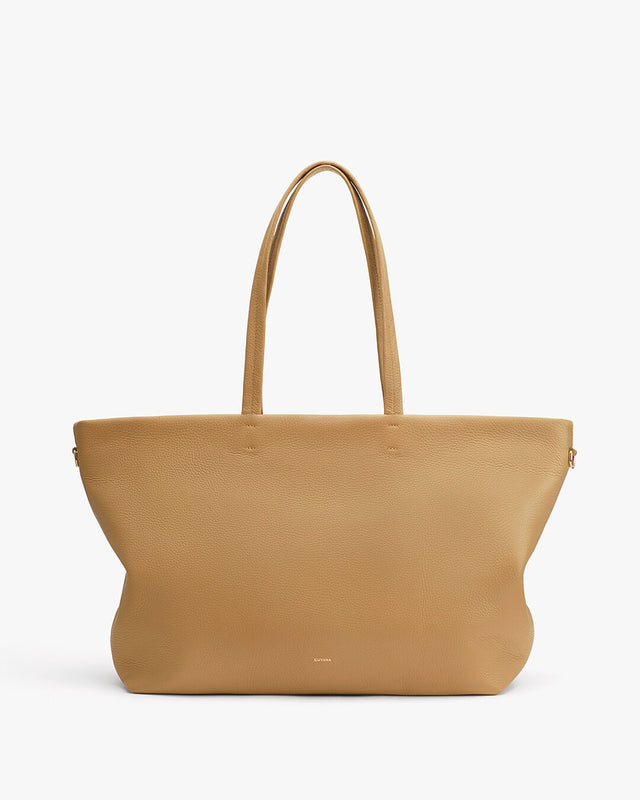 Large tote bag with two handles standing upright.