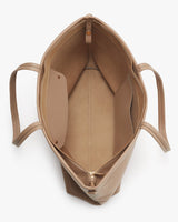 Open handbag viewed from above showing the interior storage space.