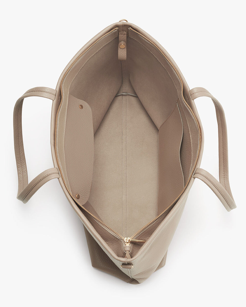 Top view of an open empty bag with handles and a zip closure.