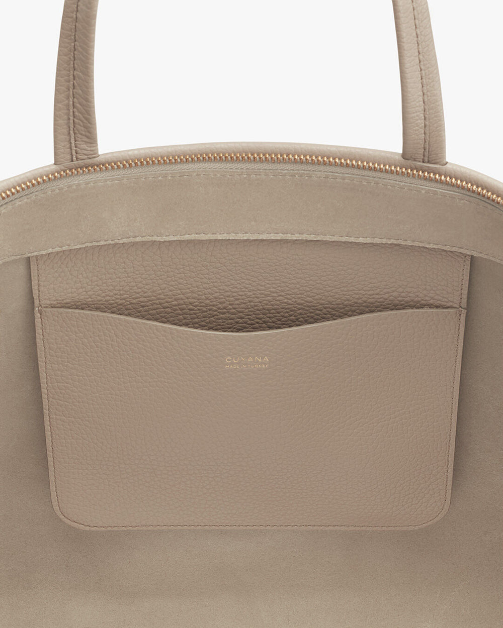Close-up of a handbag with a front pocket and zipper.