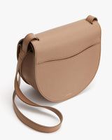 Leather shoulder bag with front flap and adjustable strap.
