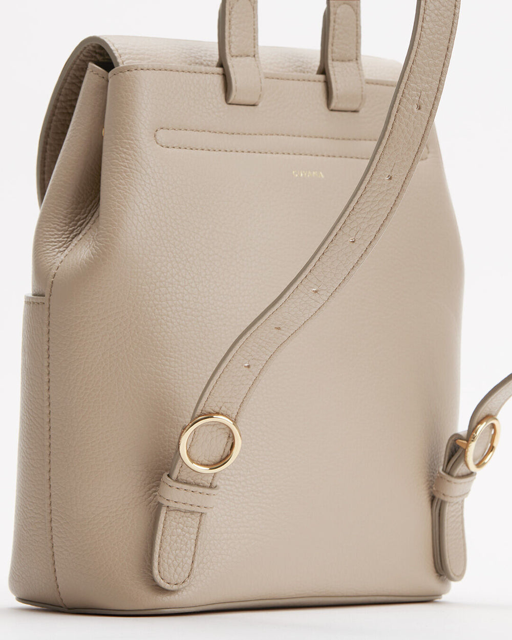 Handbag with a shoulder strap and metallic loop accents.