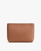 Leather pouch on a plain background.