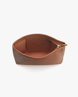 Small open zipper pouch on a plain background