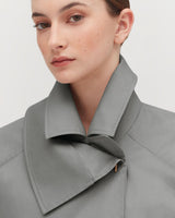 Close-up of a woman wearing a shirt with a large collar.