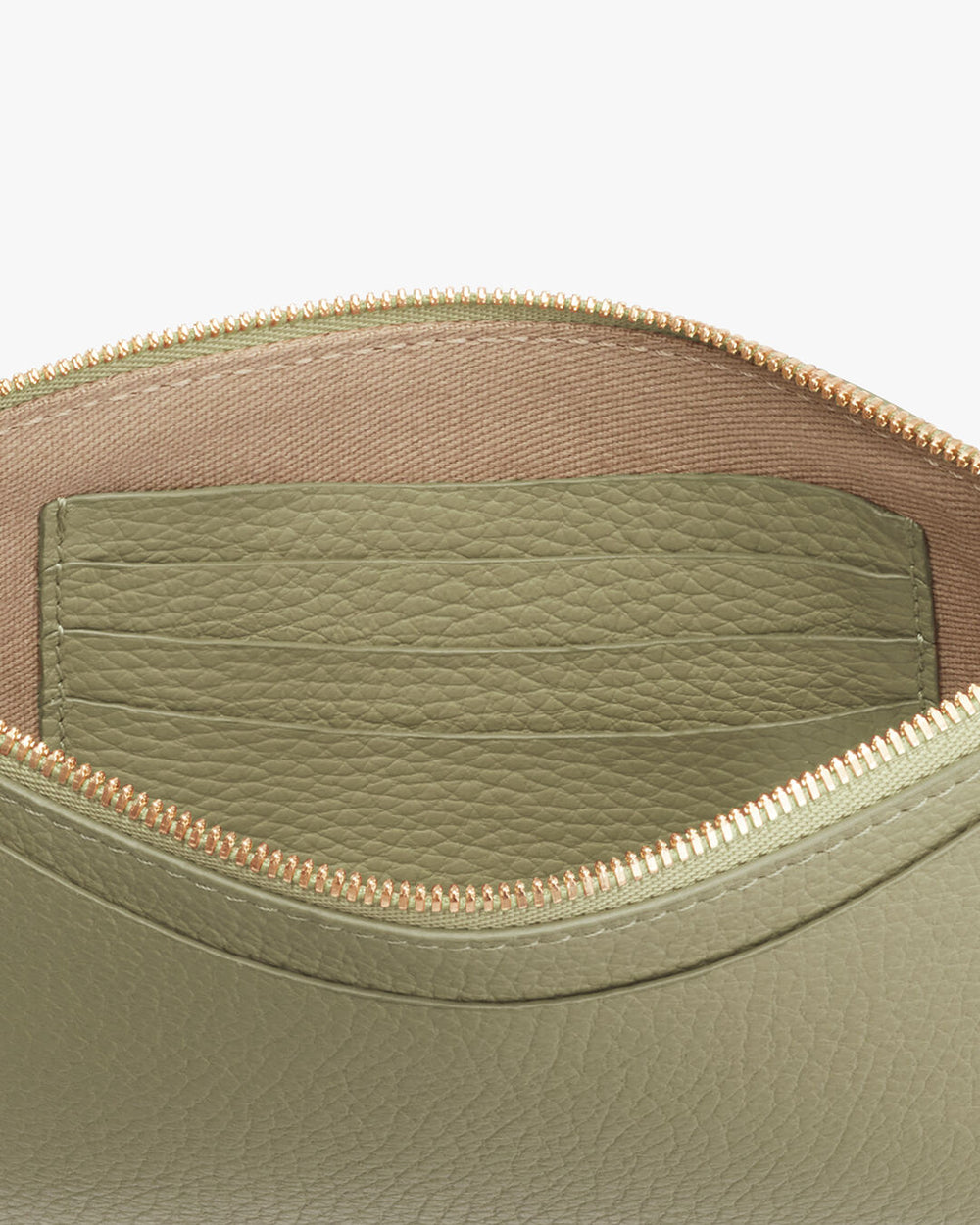 Slim Wristlet Wallet Open leather bag with visible stitching and interior pocket.