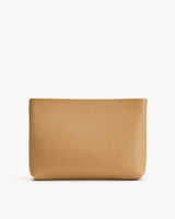 Leather pouch standing on a plain background.