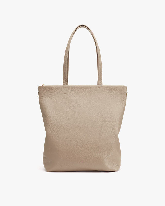 Handbag with two top handles and zipper closure.