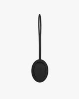 Round object with a looped strap attached at the top.
