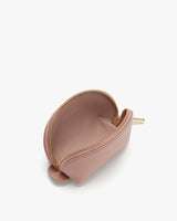Unzipped half-circle shaped small bag on a plain background.