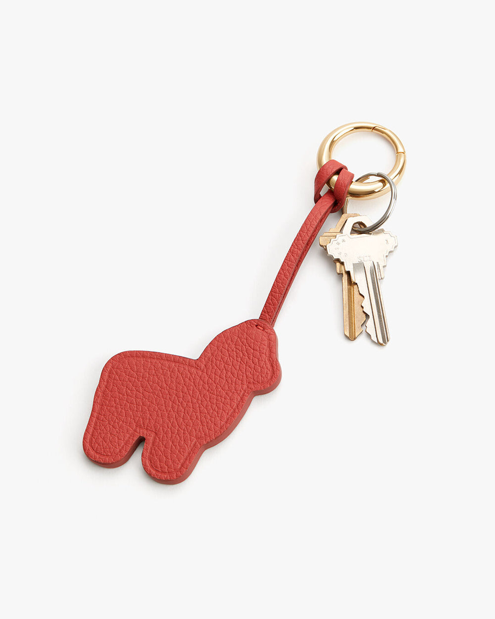 Keychain shaped like an alpaca with attached keys on a ring