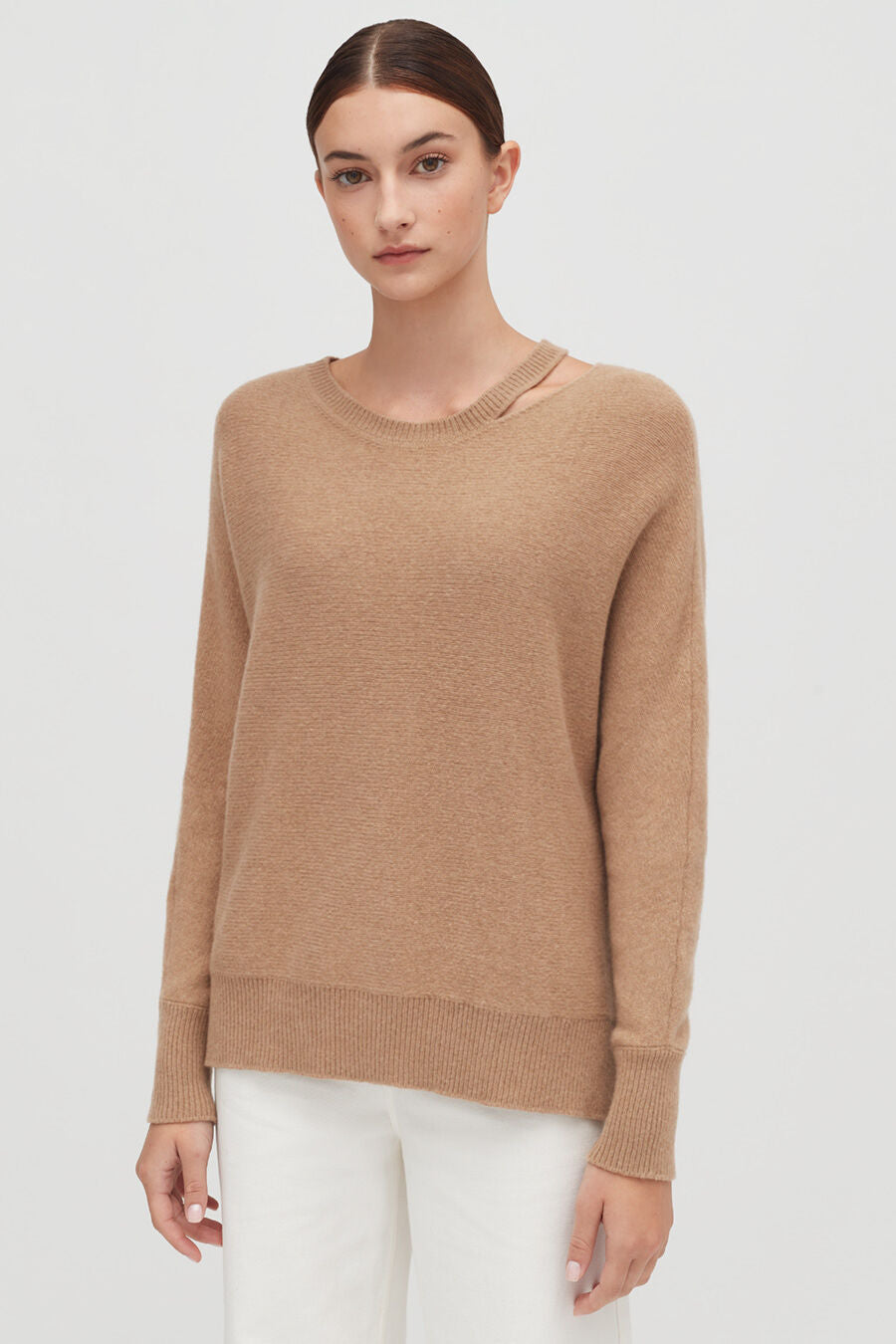 Recycled Cashmere Split-Neck Sweater Person wearing a sweater and white pants standing straight.