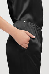 Person's hand in a pocket of their dress