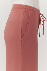 Close-up of a person wearing drawstring pants
