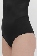 Close-up of a person wearing a one-piece swimsuit.