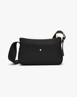 Small purse with front flap and adjustable strap.