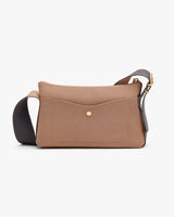 Handbag with textured surface and a shoulder strap.