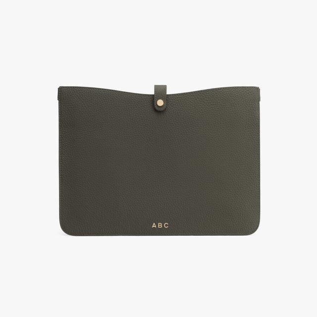 Clutch bag with snap closure and personalized initials.