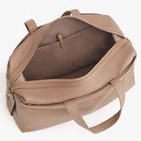 Open weekender travel bag with handles and zippers.
