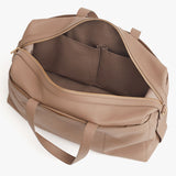 Travel bag with zipper closure and shoulder strap.