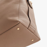 Close-up view of a bag corner with metal studs.
