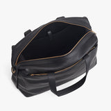 Overhead view of a closed weekender travel bag with handles and zipper closures.