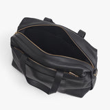 Open weekender travel bag with zippers and handles.