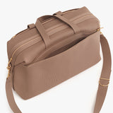 Messenger bag with handles and a shoulder strap.