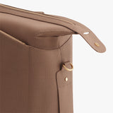 Close-up of a bag with a zipper and handle.