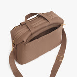 Open handbag with a shoulder strap and top handle.