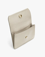 Open wallet with snap closure on white background.